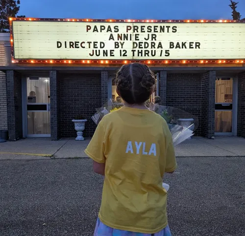 Ayla Looking at the Annie Jr Marquee