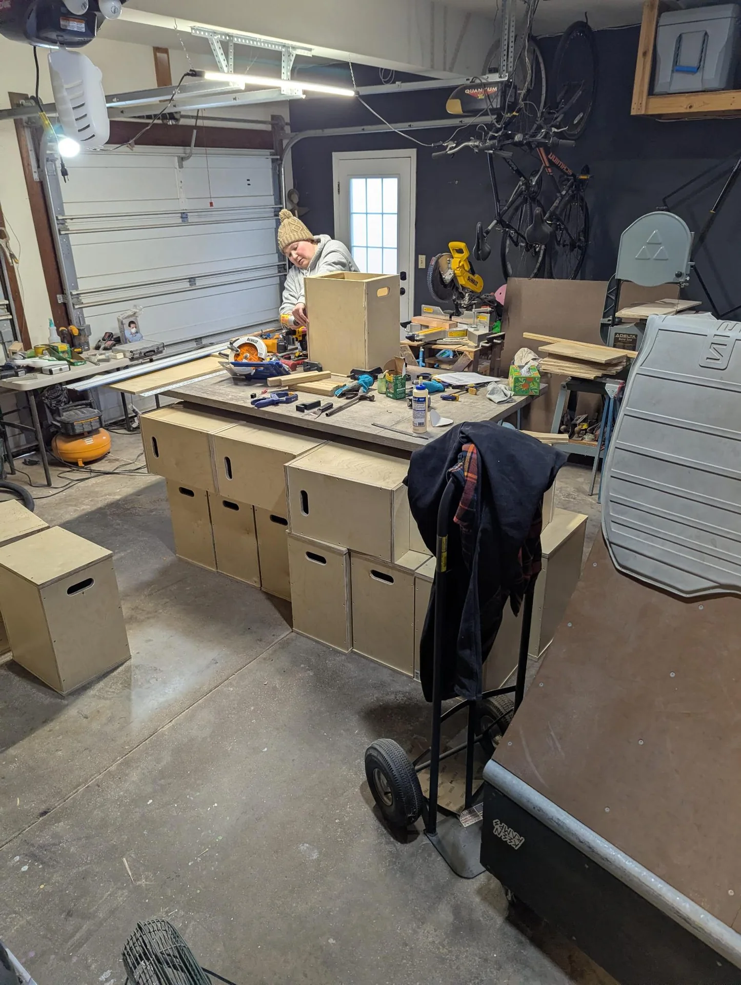 Garage workspace filled with tools and boxes