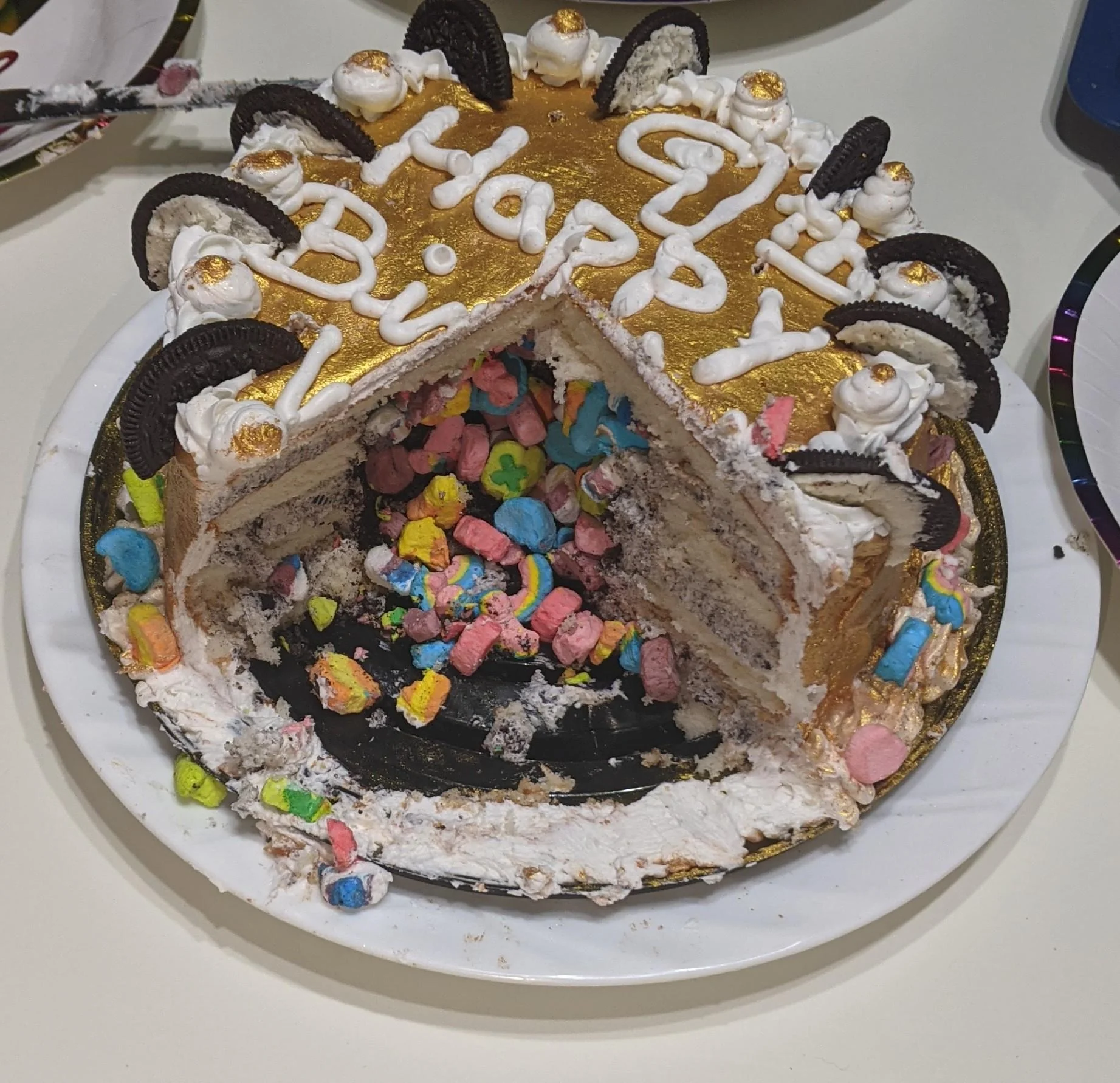 Chocolate birthday cake cut open to reveal candy