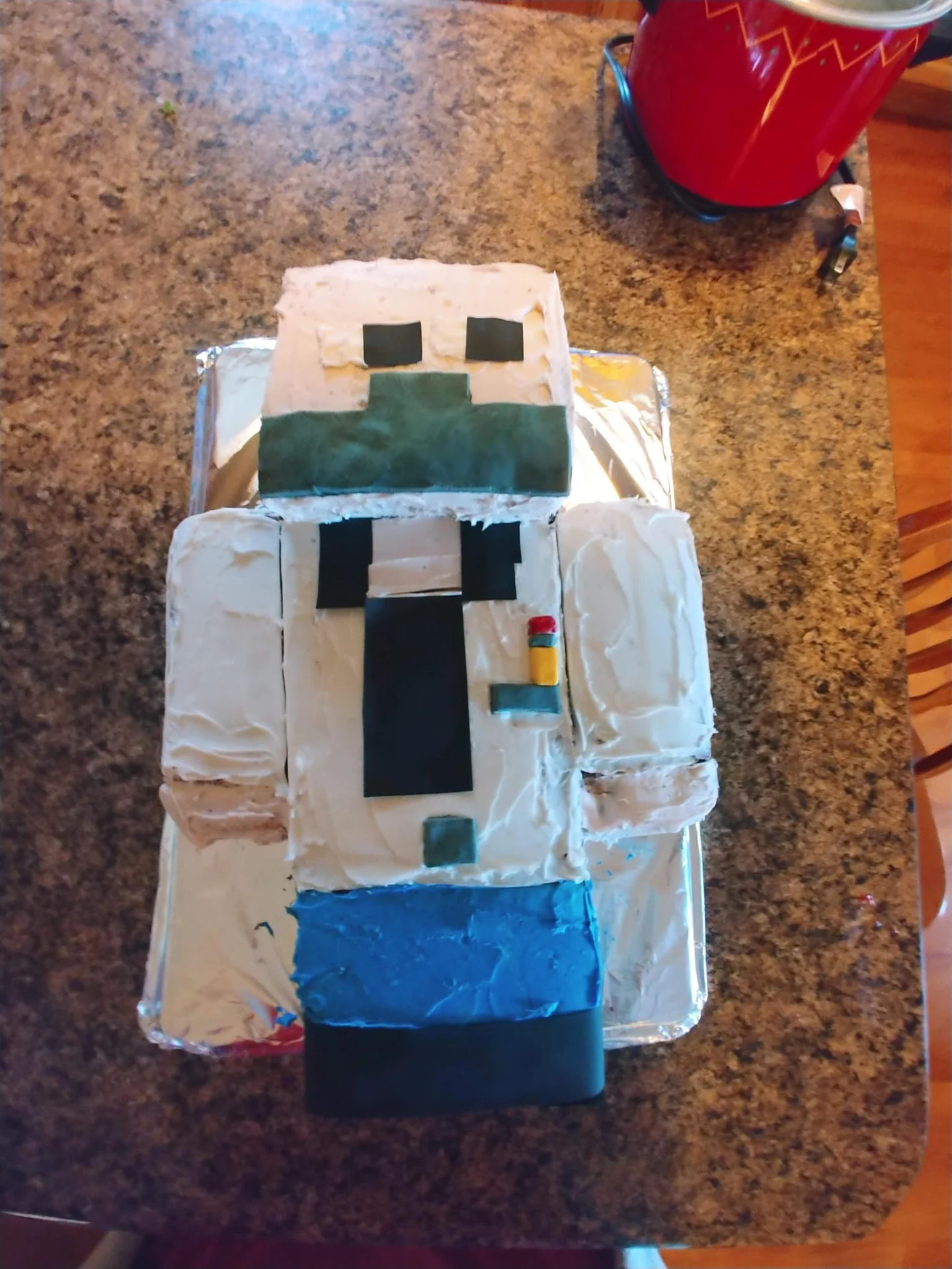 Handmade block-shaped plush figure on a carpet