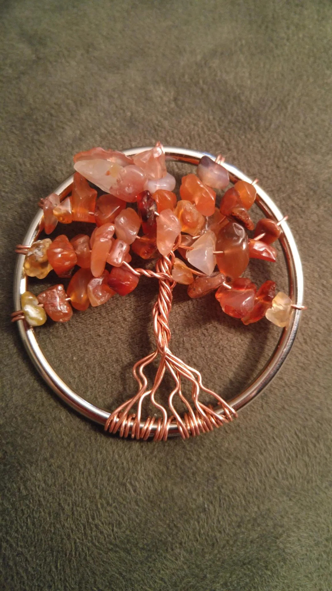 Copper wire tree pendant with orange stones