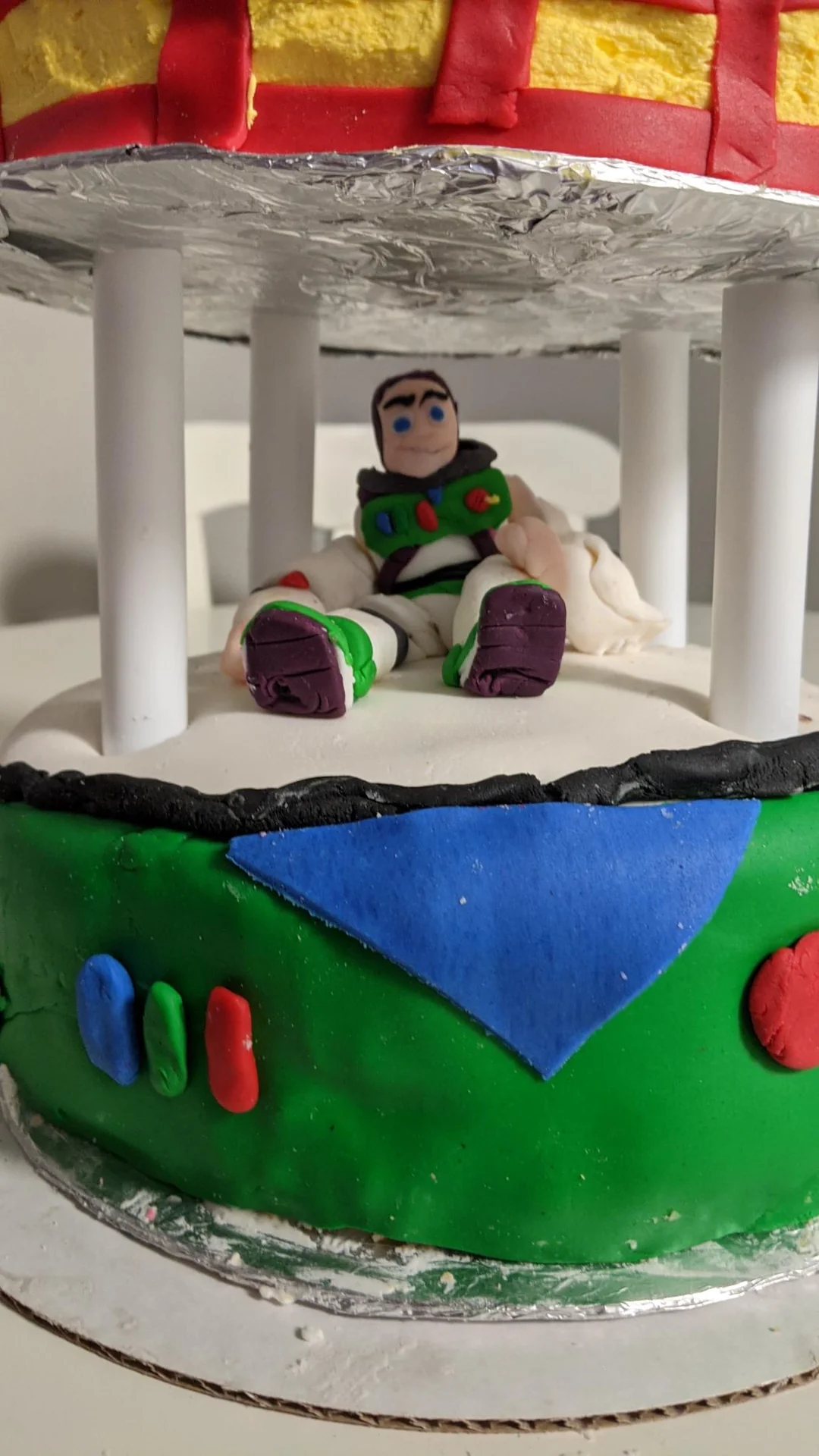 Close view of the Buzz Lightyear figure on a cake