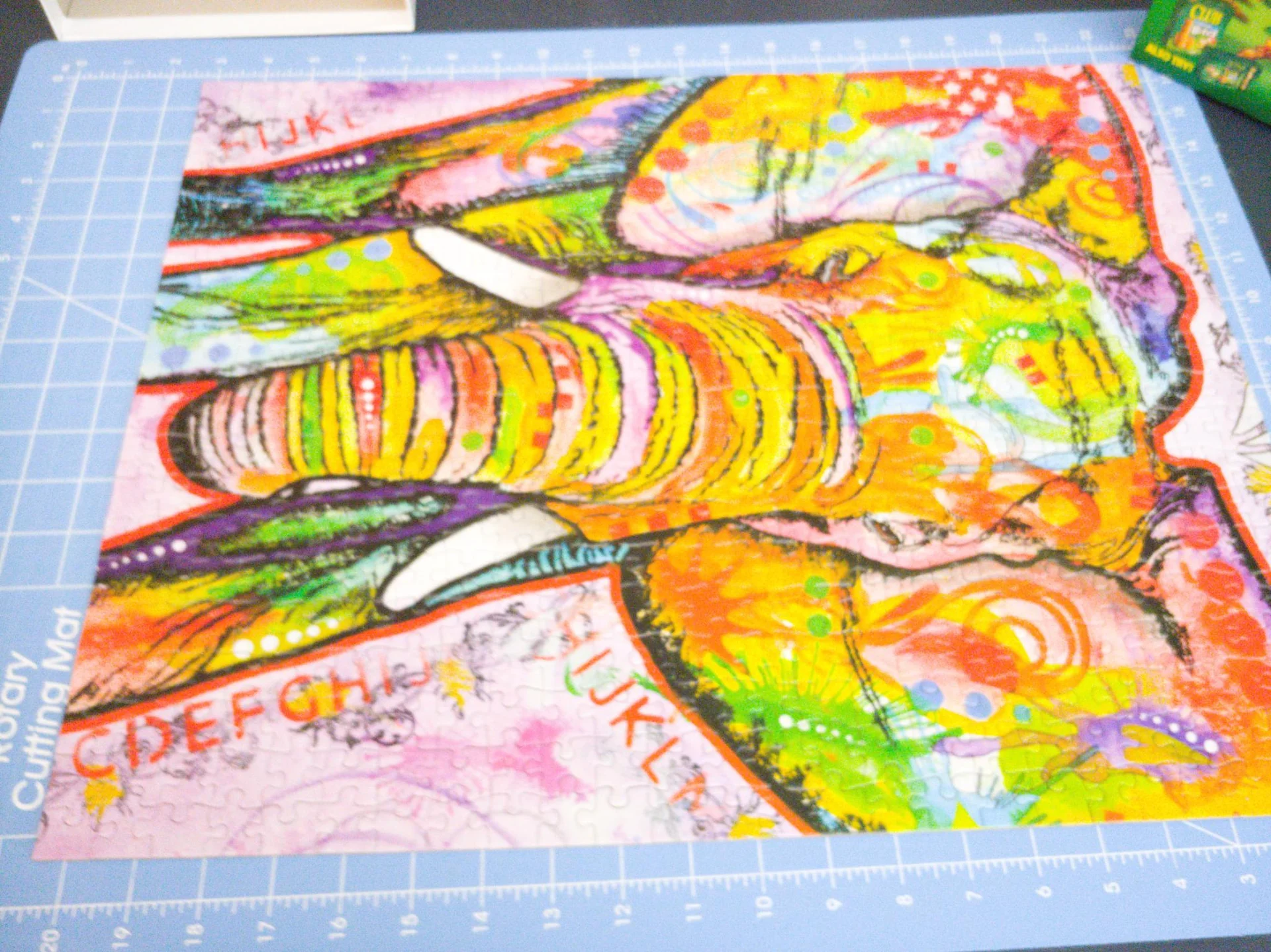 Colorful jigsaw puzzle of a horse on a cutting mat