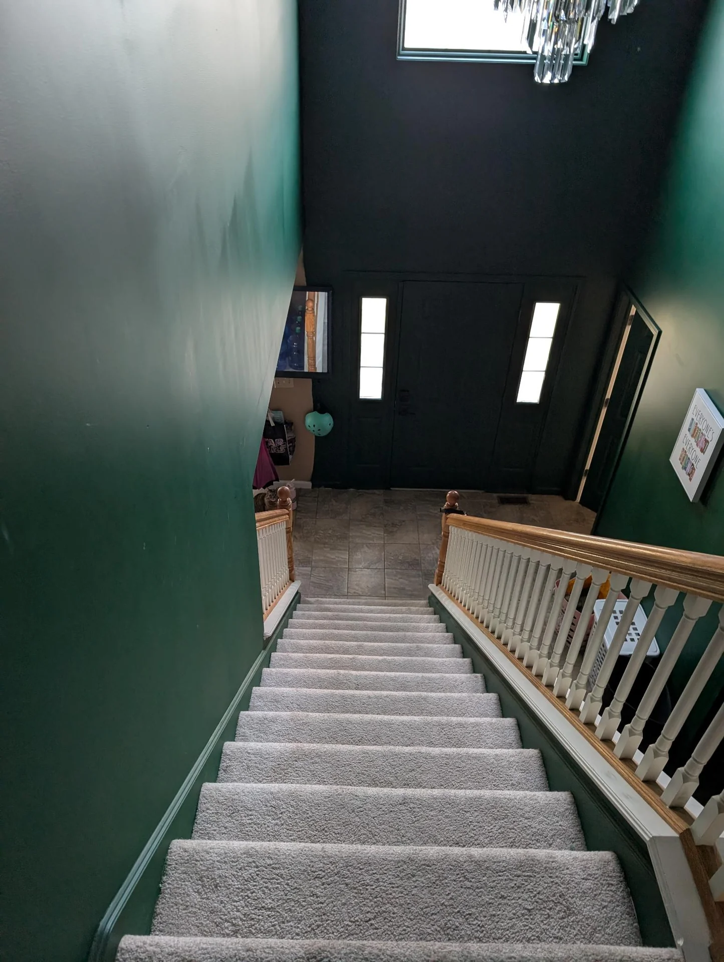 Dark green stairwell leading to a front door