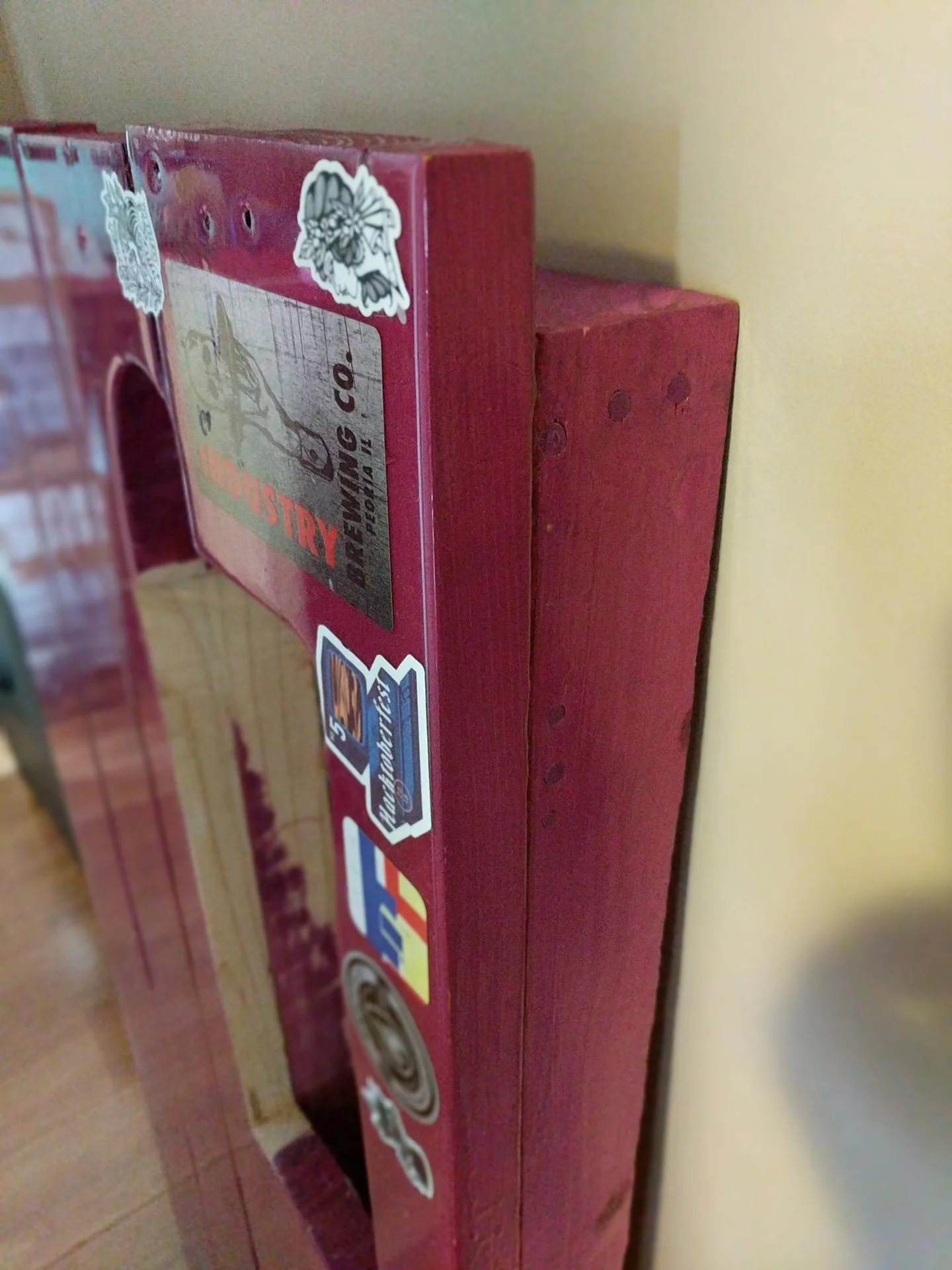 Pink painted furniture piece with stickers