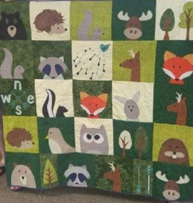 Quilt made of animal and woodland appliqué blocks