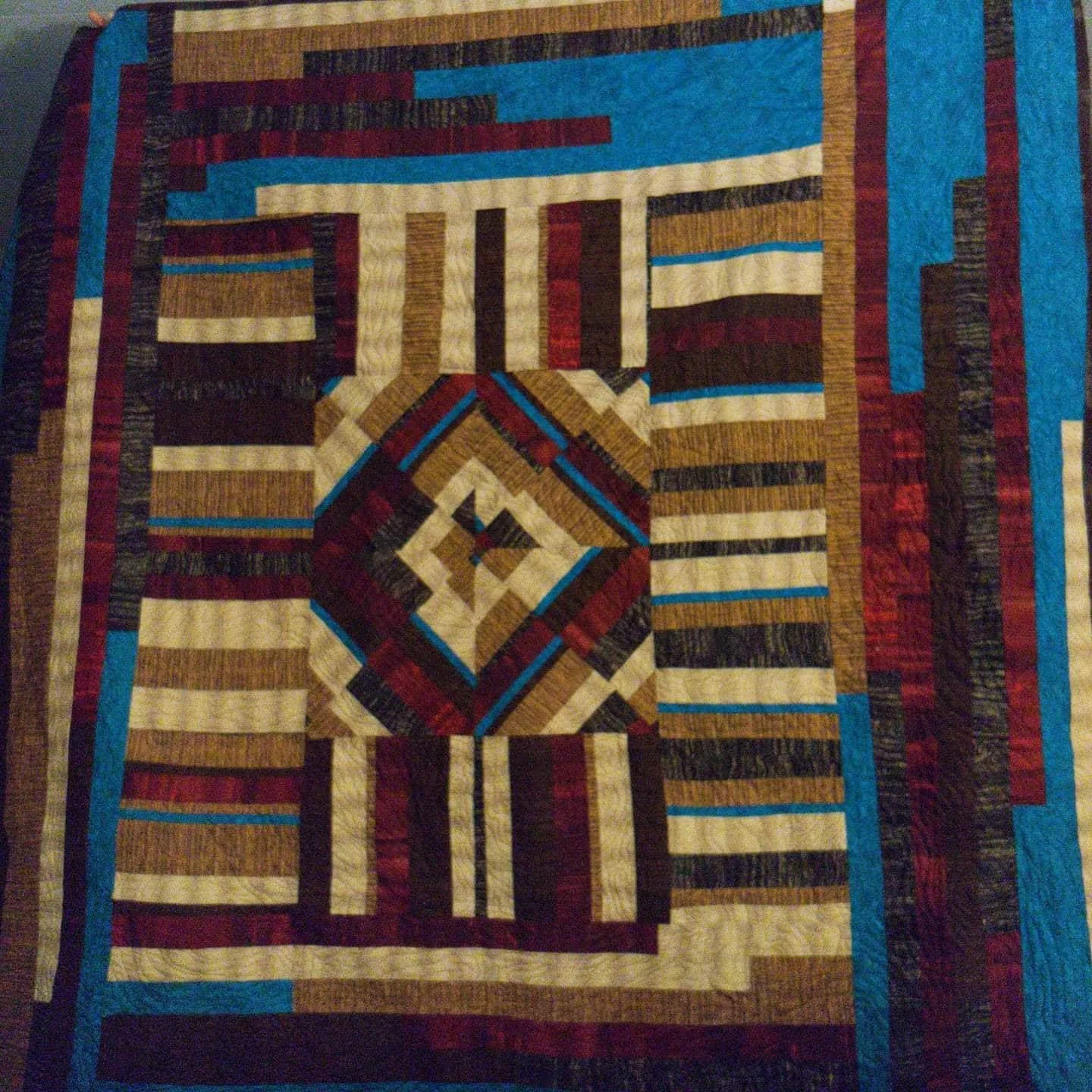 Geometric quilt with nested diamond patterns