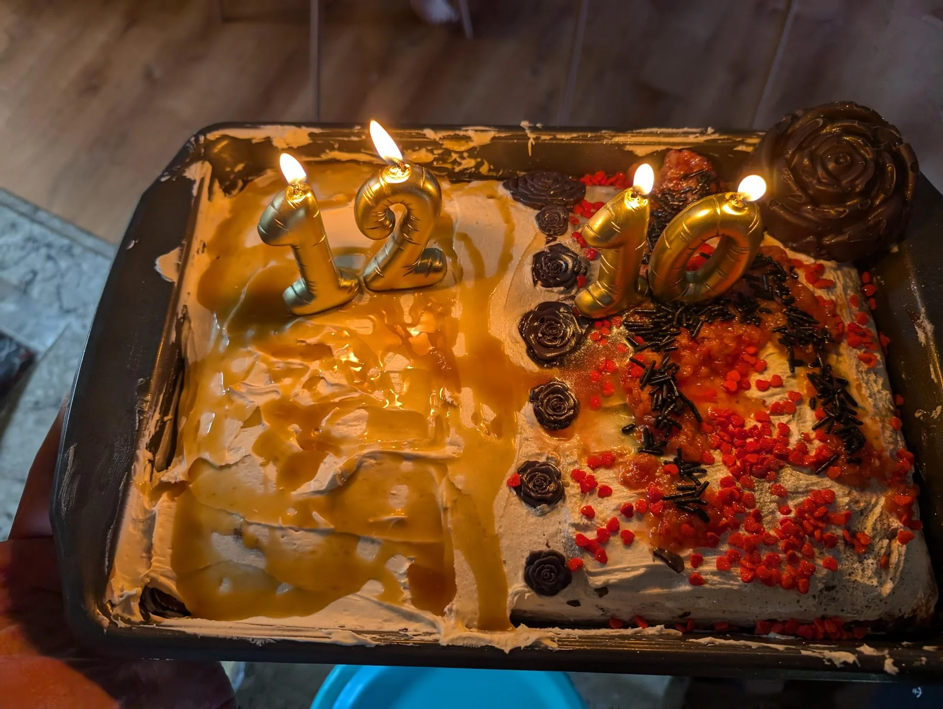 Rectangular birthday cake with lit number candles