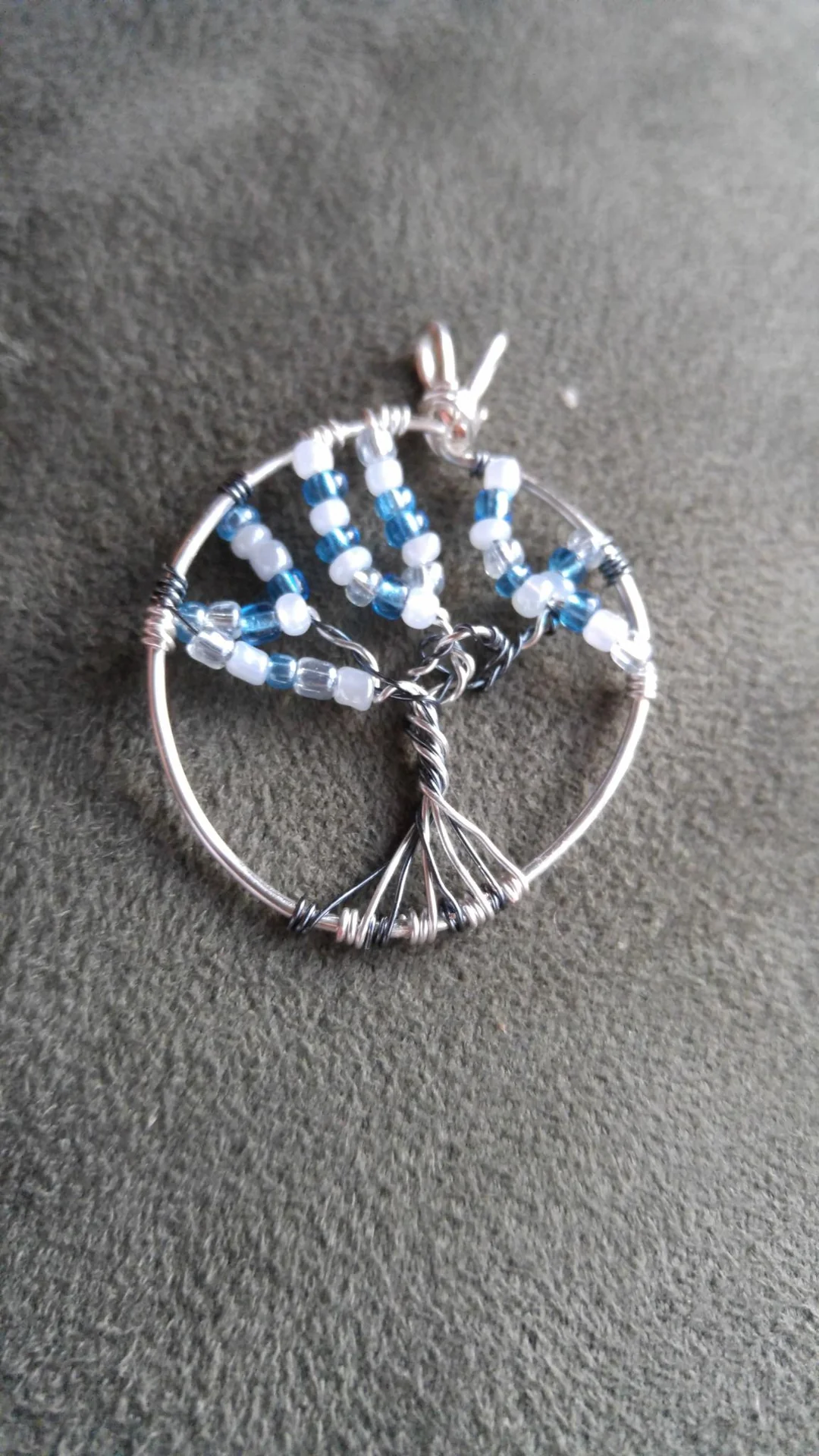 Silver wire tree pendant with blue beads