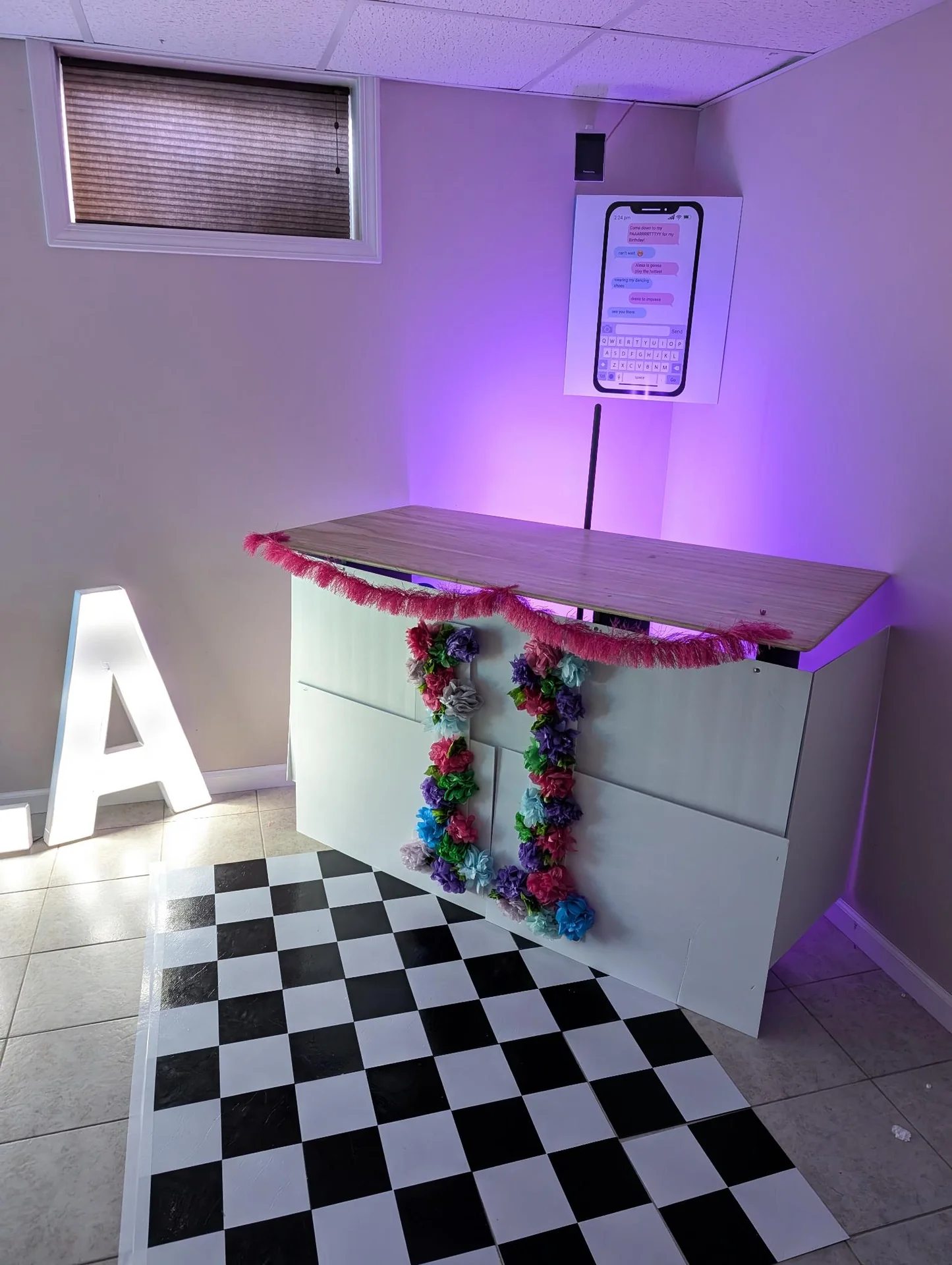 Craft table in a purple-lit room