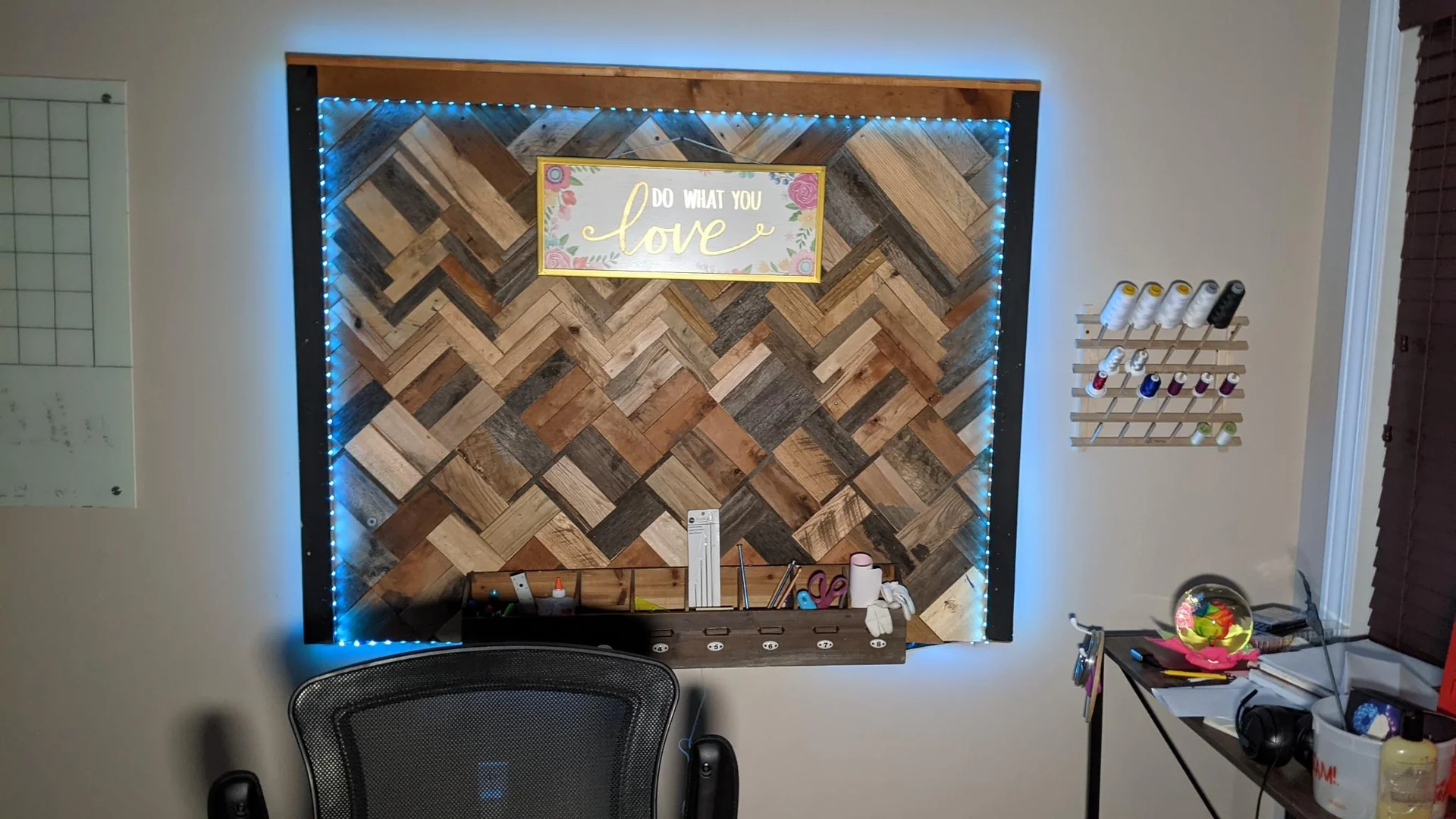 Geometric wood wall art edged with blue lights