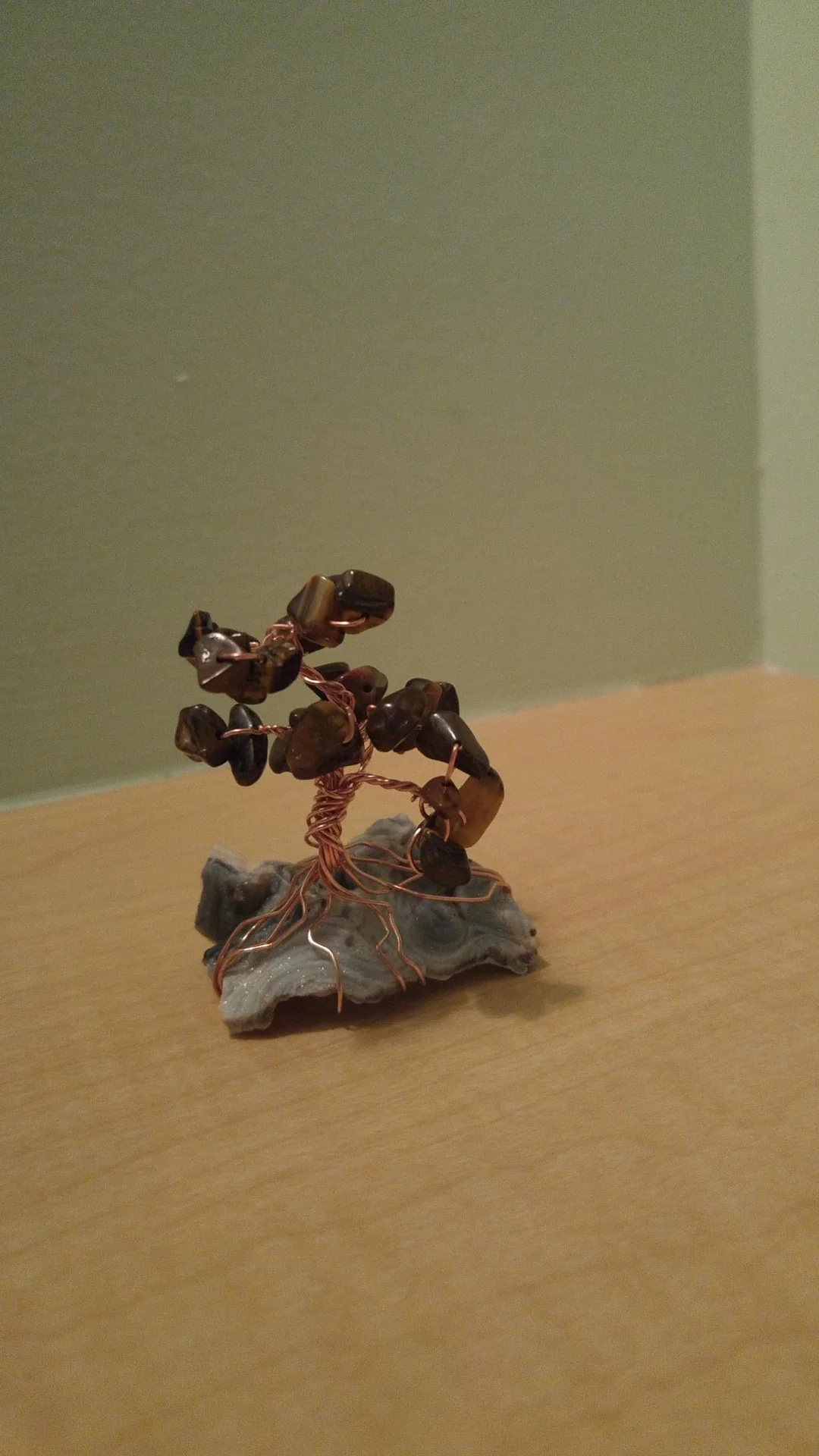 Small wire tree sculpture with dark stones