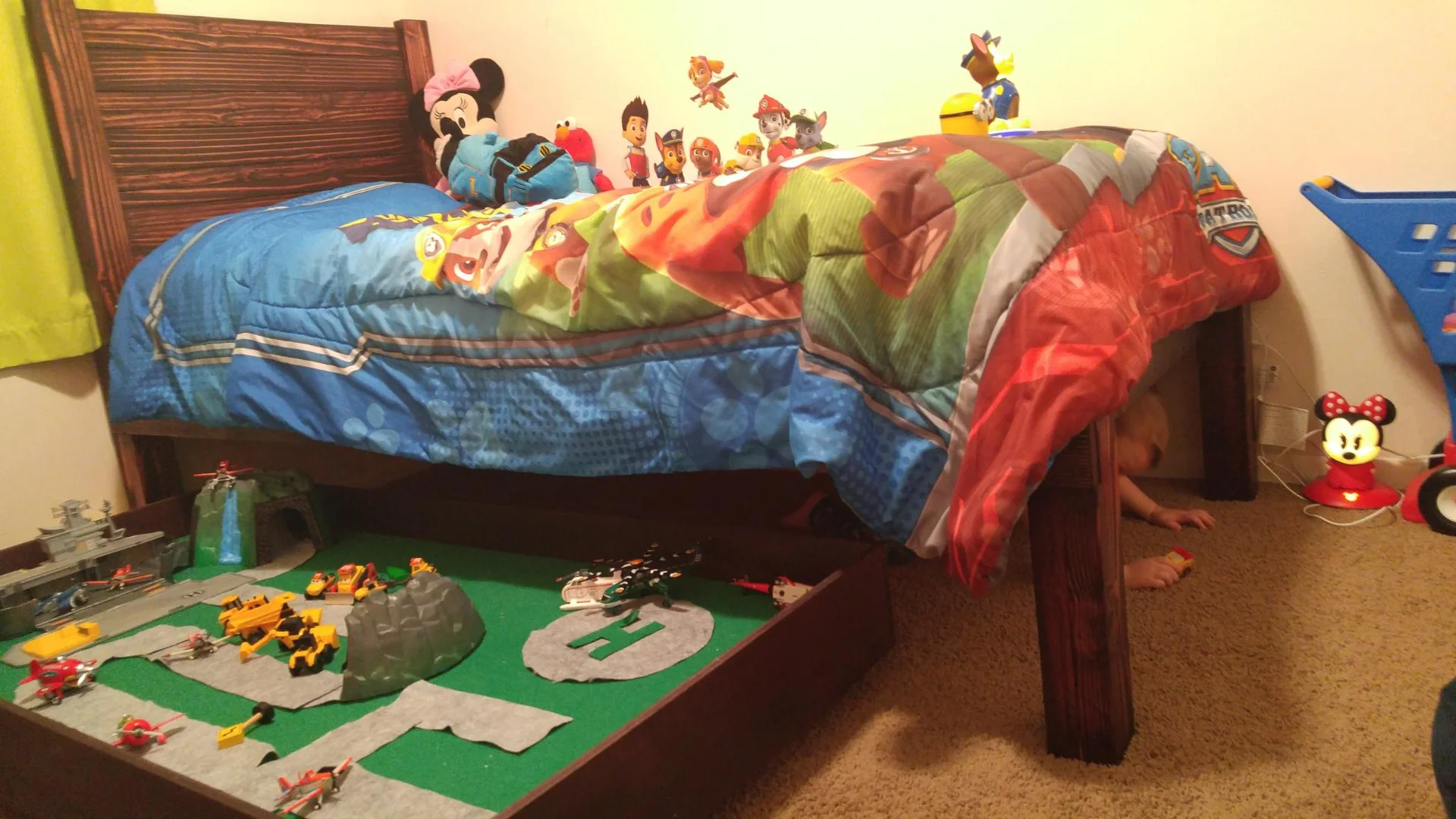 Child’s bed with colorful bedding and toys