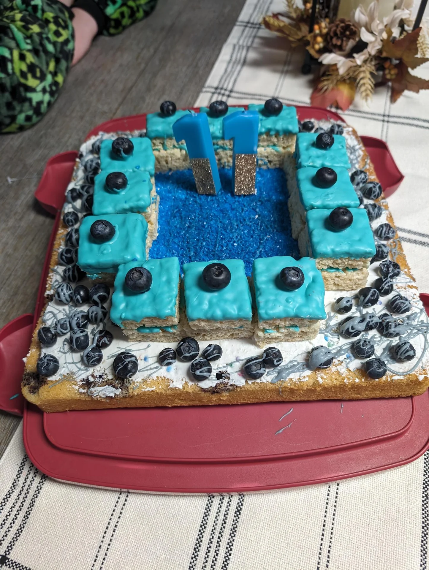 Square cake decorated with blue and black blocks