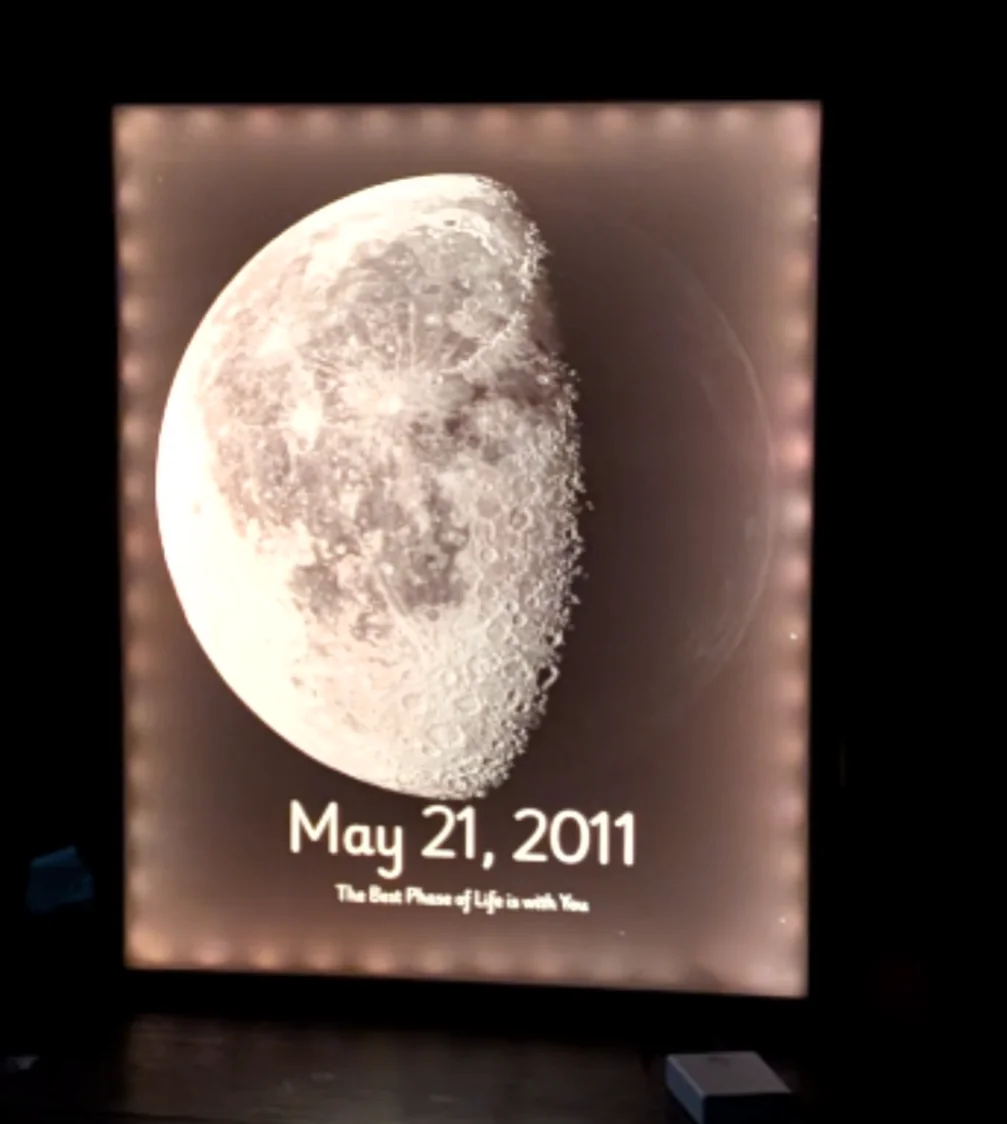 Framed moon print lit around its edge